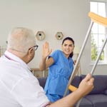 A retired senior man displaying aggressive behaviour during a medical check-up, highlighting the challenges of managing violence and aggression in healthcare setting