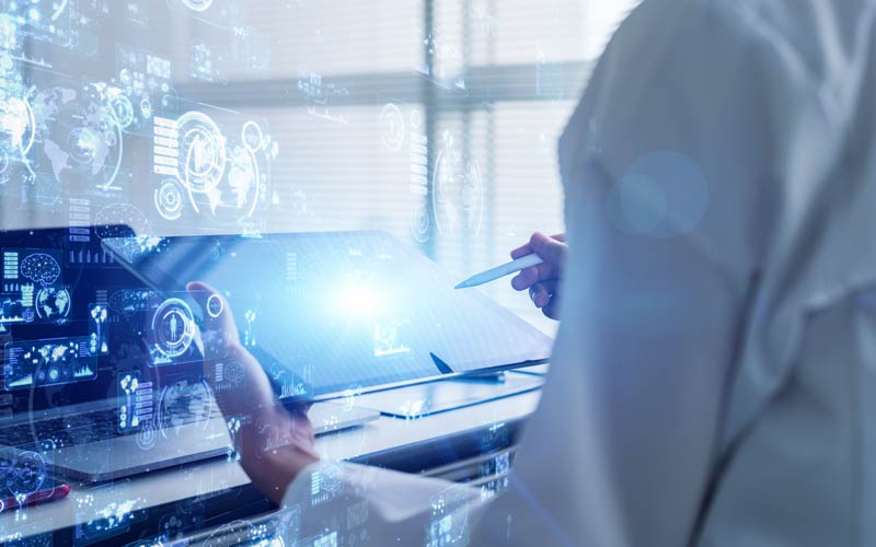 Researcher holding a tablet computer and stylus